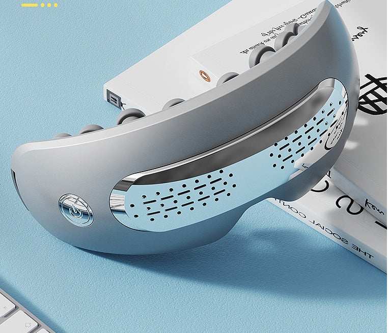 Electric hot compress eye massager with heat, vibration, and air compression for migraine relief and eye fatigue